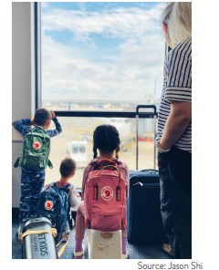 Picture of children looking out airport window